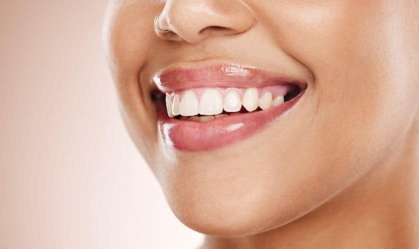 a woman smiling after received cosmetic dental treatments in Chicago